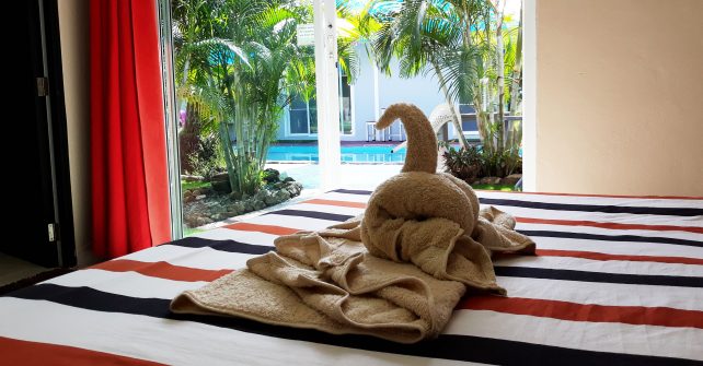 Towel on Bed Shaped as a Swan